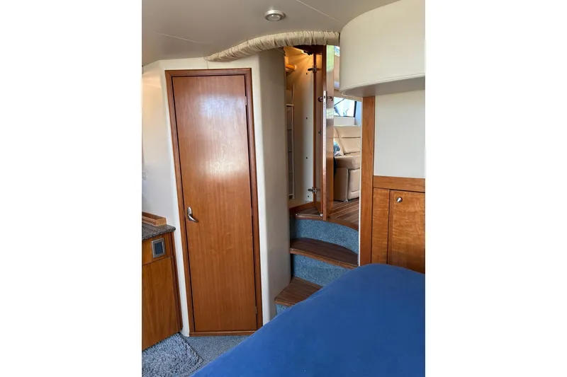 Slide: The Image of Interior of 2004 Meridian 459 Motoryacht with wooden cabinetry and carpeted steps. - 20