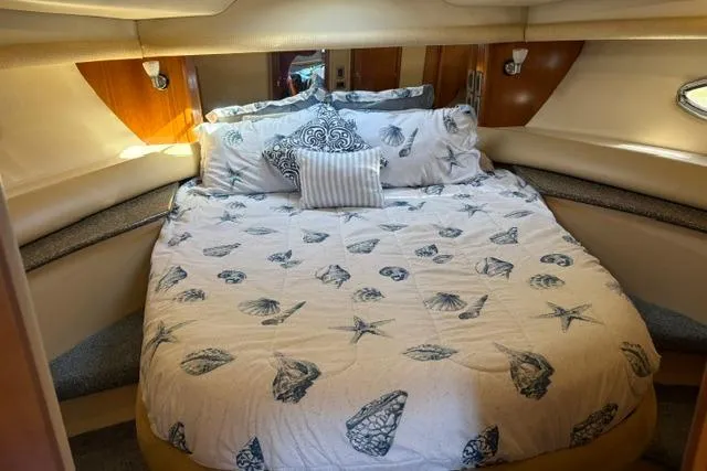 Slide: The Image of Luxurious bedroom interior of 2004 Meridian 459 Motoryacht with seashell-themed bedding. - 21