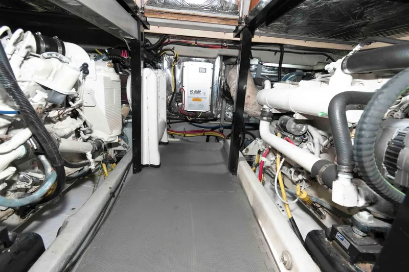 Slide: The Image of Engine room of 2004 Meridian 459 Motoryacht with visible machinery and wiring. - 30