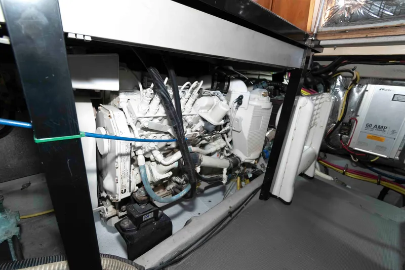 Slide: The Image of Engine room of 2004 Meridian 459 Motoryacht, showcasing mechanical components and wiring. - 32
