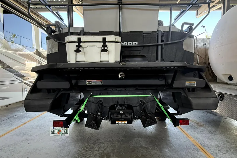 Slide: The Image of 2022 Sea-Doo Switch Cruise 18 rear view in storage, showcasing its design and features. - 4