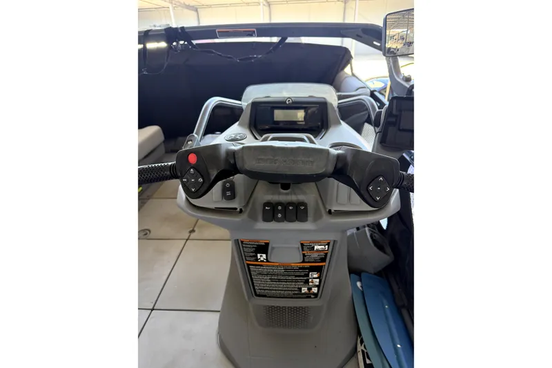 Slide: The Image of 2022 Sea-Doo Switch Cruise 18 dashboard with steering controls and display. - 5