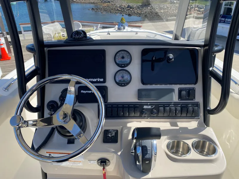 Slide: The Image of 2022 Boston Whaler 230 Outrage helm with instruments. - 11