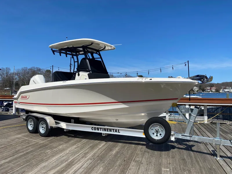Slide: The Image of Boston Whaler 230 Outrage 2022 on trailer at dock. - 6