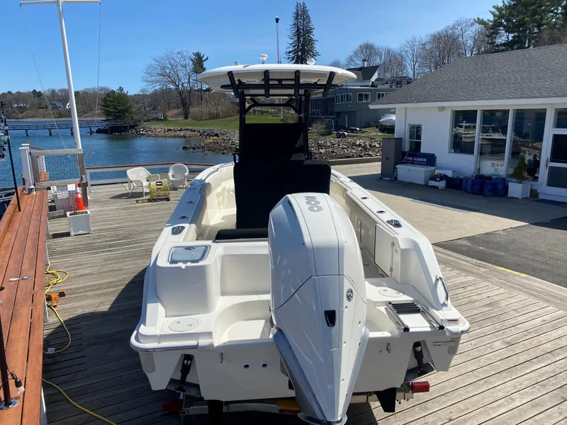 Slide: The Image of 2022 Boston Whaler 230 Outrage on a dock, ready for launch. - 7