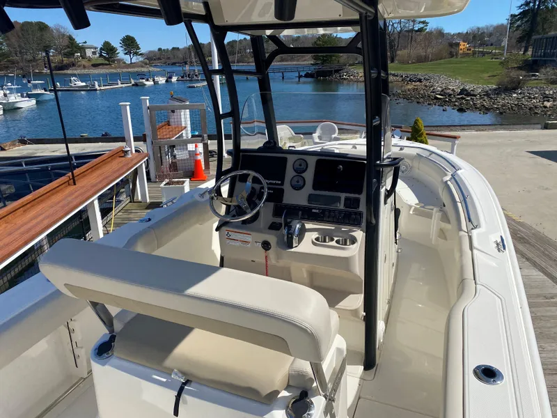 Slide: The Image of Interior view of a 2022 Boston Whaler 230 Outrage boat at dock. - 8