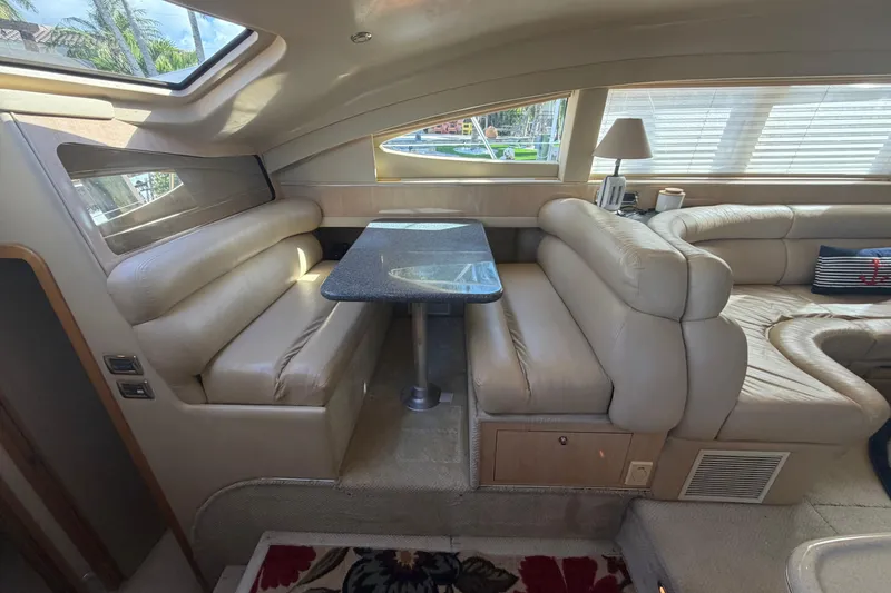 Slide: The Image of Luxurious interior of 2002 Sea Ray 480 Motor Yacht with plush seating and elegant table. - 20