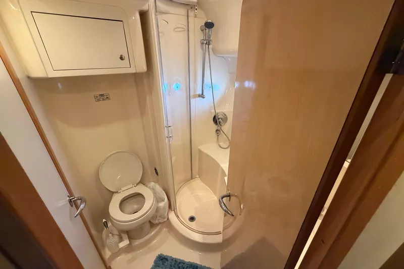 Slide: The Image of 2002 Sea Ray 480 Motor Yacht bathroom with shower and toilet. - 25