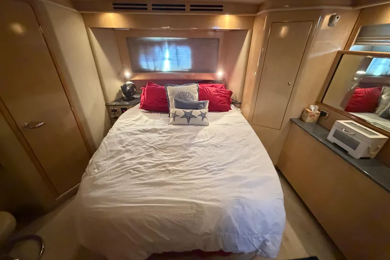 Slide: The Image of Luxurious bedroom interior of 2002 Sea Ray 480 Motor Yacht with cozy bedding. - 32