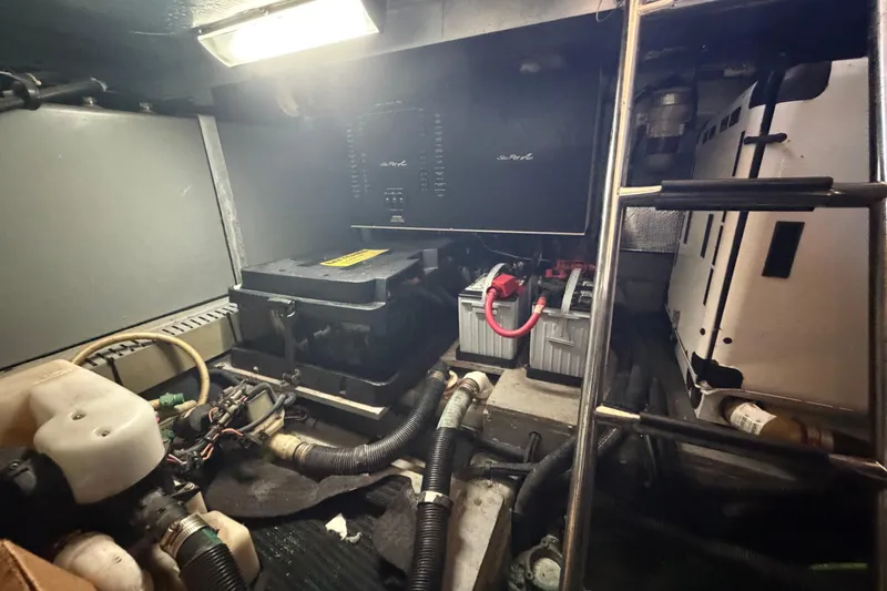 Slide: The Image of Engine room of 2002 Sea Ray 480 Motor Yacht with batteries and wiring. - 38