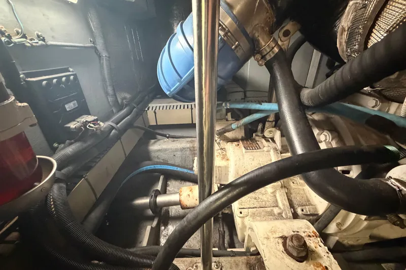 Slide: The Image of Engine room of 2002 Sea Ray 480 Motor Yacht with visible hoses and components. - 39