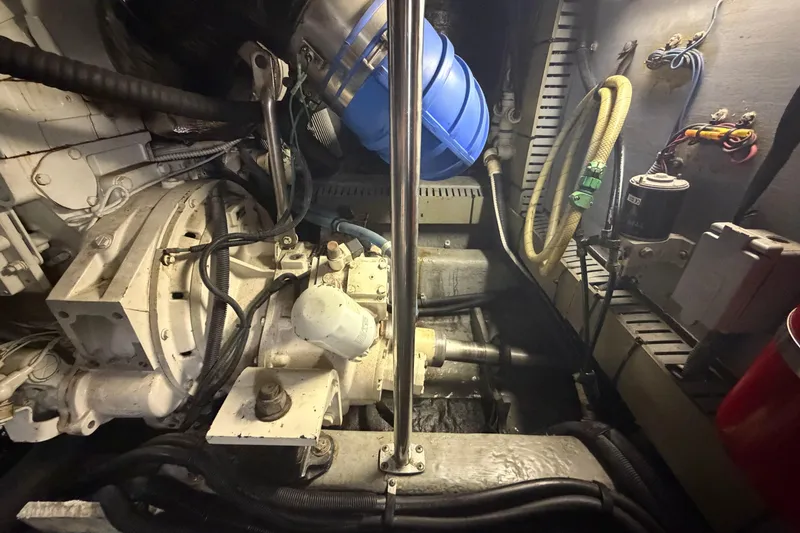 Slide: The Image of Engine room of a 2002 Sea Ray 480 Motor Yacht, showcasing mechanical components and wiring. - 40