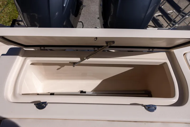 Slide: The Image of Open storage compartment on 2022 Grady-White Freedom 275 boat, showcasing interior space. - 11
