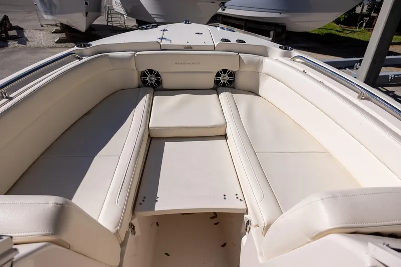 Slide: The Image of 2022 Grady-White Freedom 275 boat interior with white cushioned seating. - 17