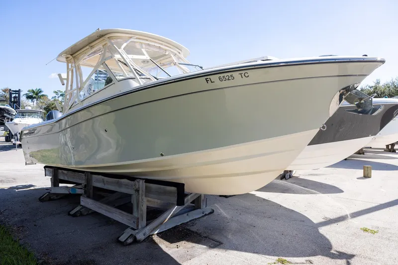 Slide: The Image of 2022 Grady-White Freedom 275 boat interior with Yamaha engines and seating area. - 4