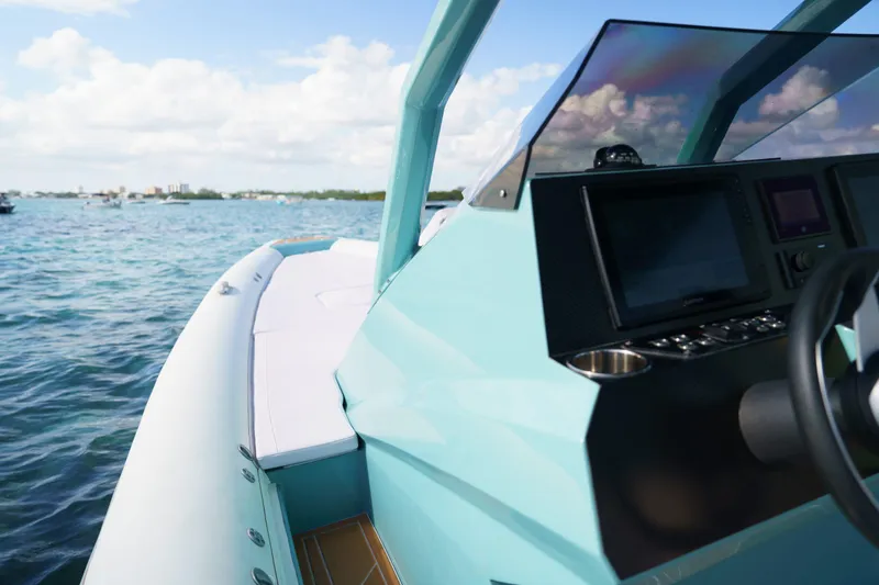 Slide: The Image of 2025 Novielli Veloche boat dashboard with modern controls on open water. - 11