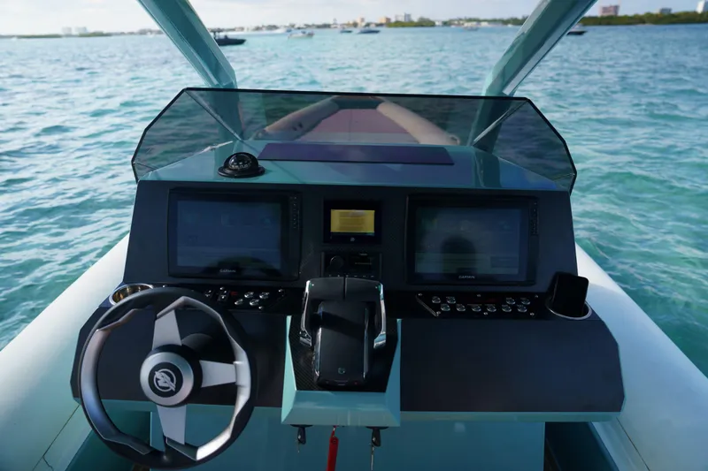 Slide: The Image of Cockpit of 2025 Novielli Veloche boat with modern navigation systems on open water. - 12