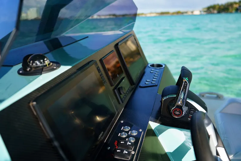 Slide: The Image of Control panel of 2025 Novielli Veloche boat with digital displays and throttle lever. - 14
