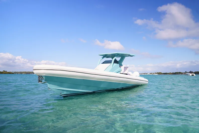 Slide: The Image of 2025 Novielli Veloche boat on clear blue water under a sunny sky. - 22