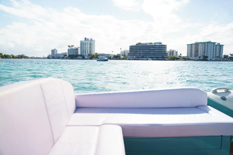 Slide: The Image of Luxurious Novielli Veloche 2025 boat interior with cityscape and ocean view. - 4