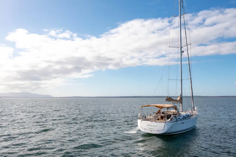 Slide: The Image of Sailing yacht Dufour 525 Grand Large 2011 on open sea under blue sky. - 13