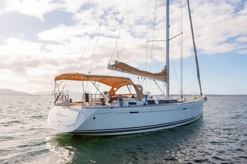 Slide: The Image of Sailing yacht Dufour 525 Grand Large 2011 on open water under a clear sky. - 15
