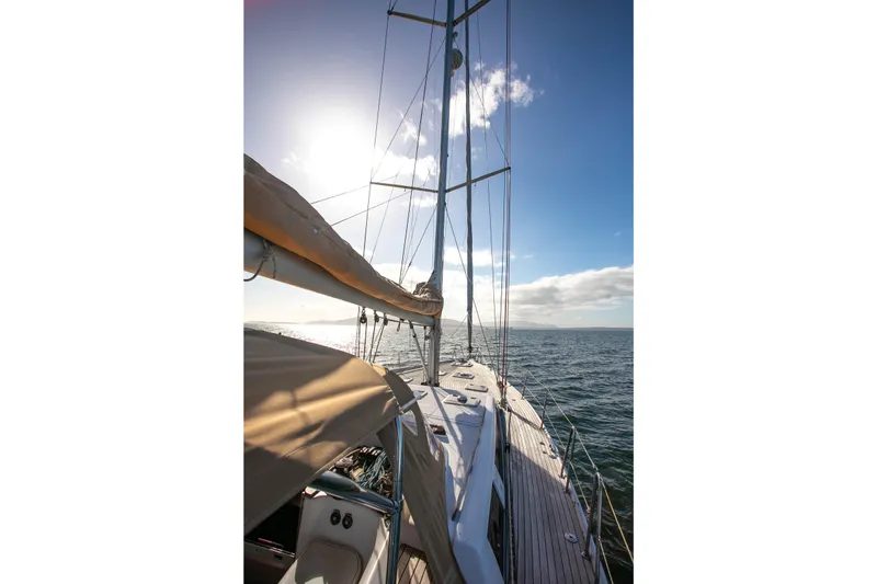 Slide: The Image of Sailing on a 2011 Dufour 525 Grand Large yacht under a clear blue sky. - 21