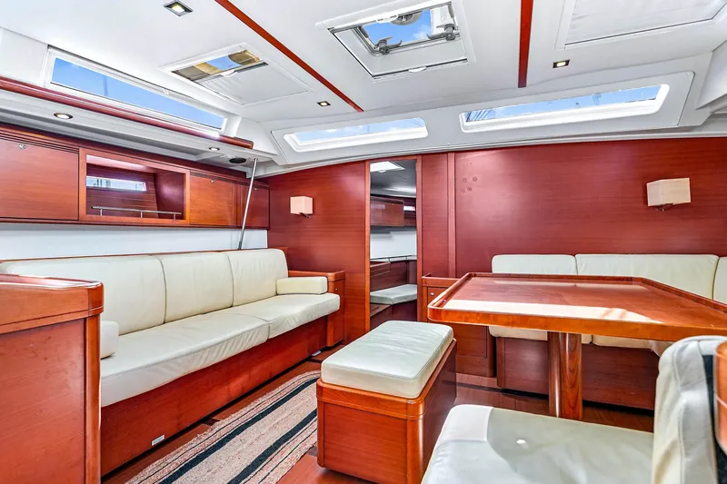 Slide: The Image of Luxurious interior of 2011 Dufour 525 Grand Large yacht with elegant wood and leather furnishings. - 25