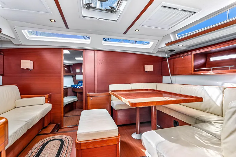 Slide: The Image of Luxurious interior of 2011 Dufour 525 Grand Large yacht with elegant wood and leather furnishings. - 26