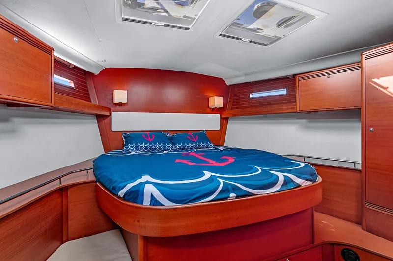 Slide: The Image of Luxurious cabin interior of 2011 Dufour 525 Grand Large yacht with nautical bedding. - 27
