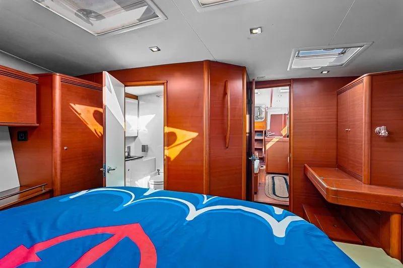 Slide: The Image of Luxurious interior of 2011 Dufour 525 Grand Large yacht with wood finish and modern amenities. - 29