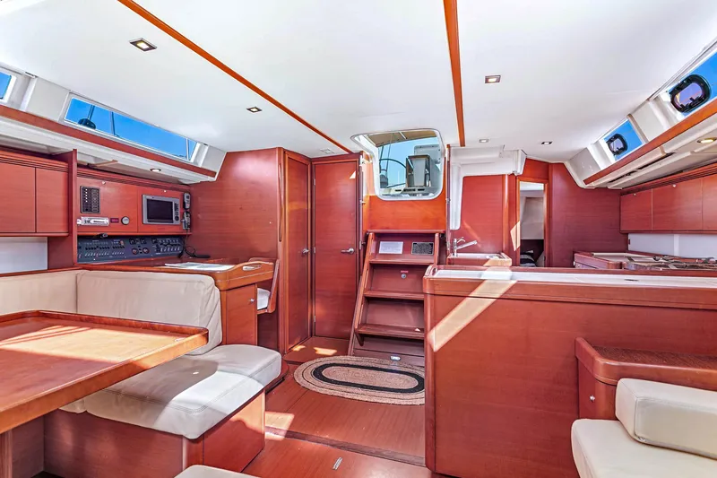 Slide: The Image of Luxurious interior of 2011 Dufour 525 Grand Large yacht with wood finish and modern amenities. - 34