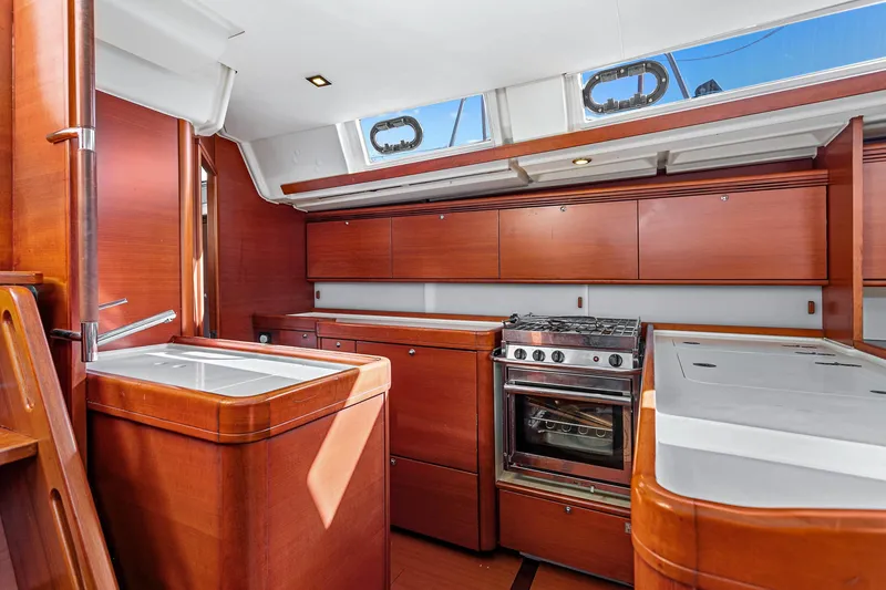 Slide: The Image of Luxurious kitchen interior of 2011 Dufour 525 Grand Large yacht with wood cabinetry. - 36