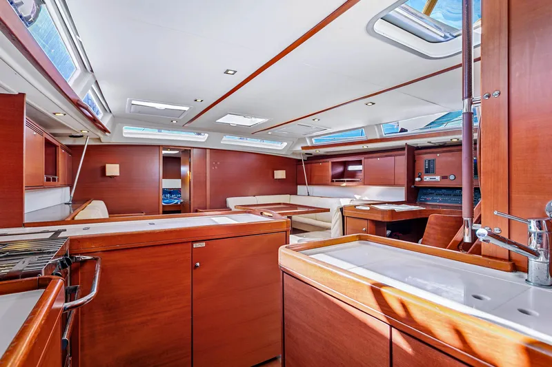 Slide: The Image of Luxurious interior of 2011 Dufour 525 Grand Large yacht with elegant wood finish. - 37