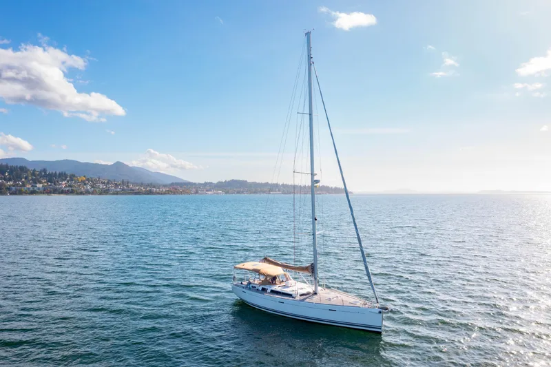 Slide: The Image of Sailing yacht Dufour 525 Grand Large 2011 on serene waters under a clear sky. - 7