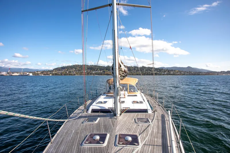 Slide: The Image of Sailing on a 2011 Dufour 525 Grand Large yacht with scenic coastal views. - 8