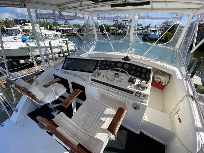 Slide: The Image of Cockpit of 1982 Bertram 46.6 War Wagon yacht with helm and seating. - 17