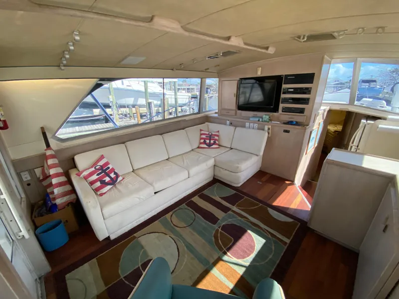 Slide: The Image of Interior of 1982 Bertram 46.6 War Wagon yacht with modern seating and nautical decor. - 21