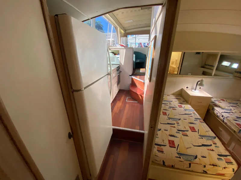 Slide: The Image of Interior of 1982 Bertram 46.6 War Wagon yacht with kitchen and cozy sleeping area. - 26