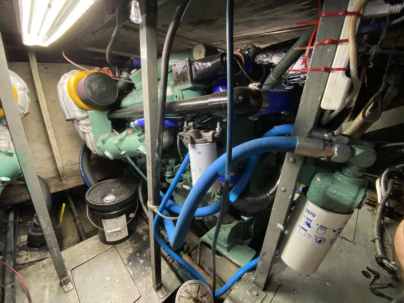 Slide: The Image of Engine room of 1982 Bertram 46.6 War Wagon with visible machinery and components. - 39