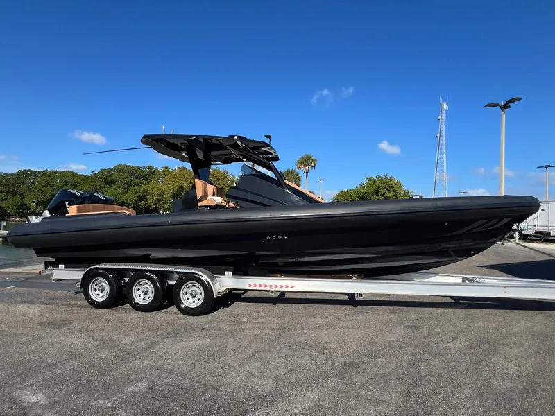 The Image of 2026 Novielli Veloche 349 boat on trailer under clear blue sky. - 0