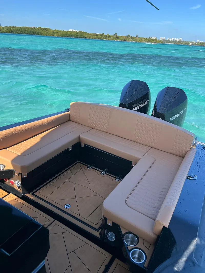 Slide: The Image of Luxurious Novielli Veloche 349 boat interior with tan seating, overlooking turquoise waters. - 11