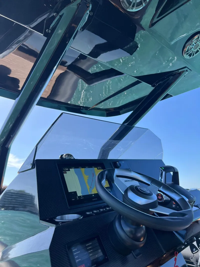 Slide: The Image of Cockpit of 2026 Novielli Veloche 349 boat with steering wheel and navigation display. - 13