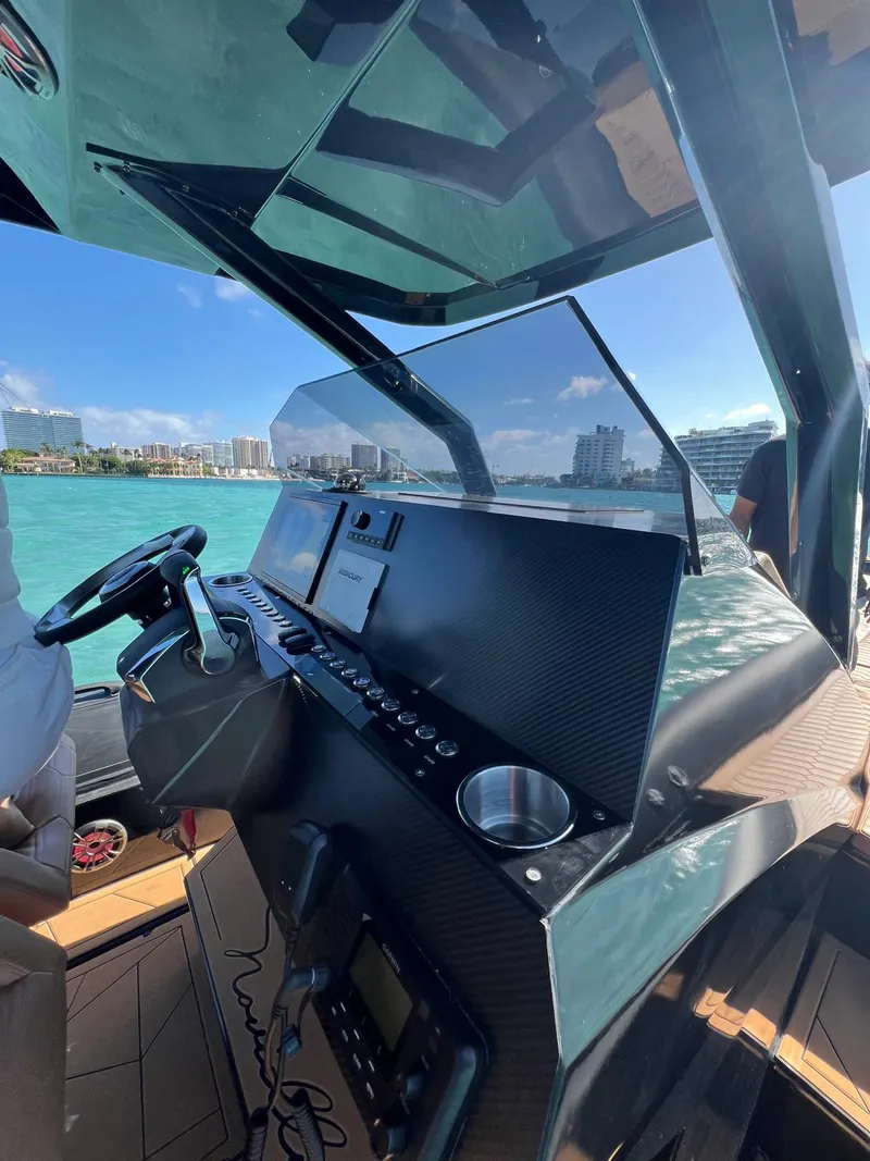Slide: The Image of Helm of Novielli Veloche 349 yacht, 2026 model, with modern controls and ocean view. - 18