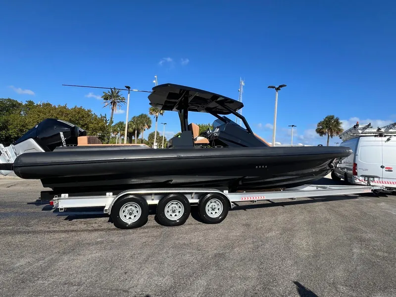 Slide: The Image of 2026 Novielli Veloche 349 boat on trailer under clear blue sky. - 4