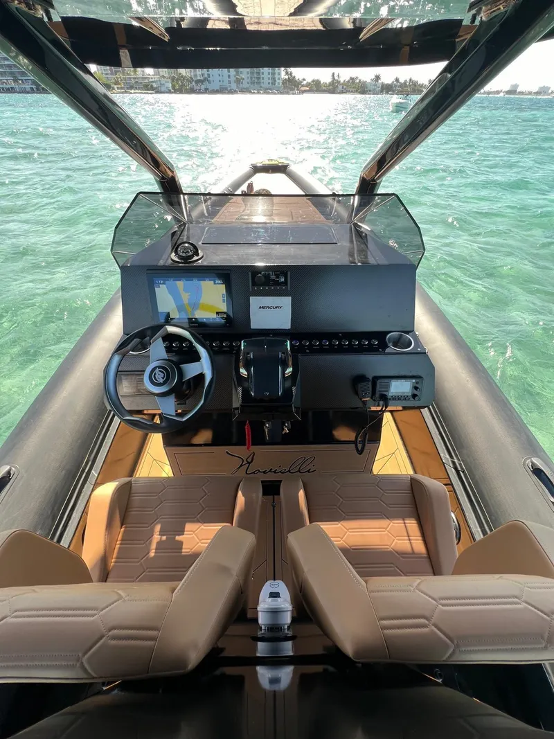 Slide: The Image of Interior view of 2026 Novielli Veloche 349 boat cockpit with steering wheel and navigation system. - 5