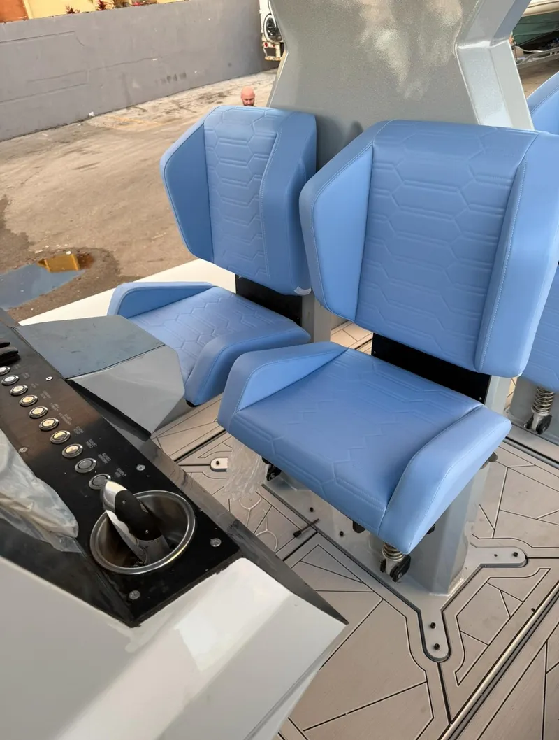 Slide: The Image of Blue seats in a 2026 Novielli Veloche 349 cockpit with control panel. - 10