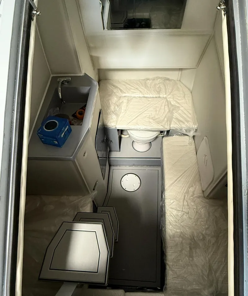 Slide: The Image of Compact interior of 2026 Novielli Veloche 349 with sink, toilet, and seating. - 5