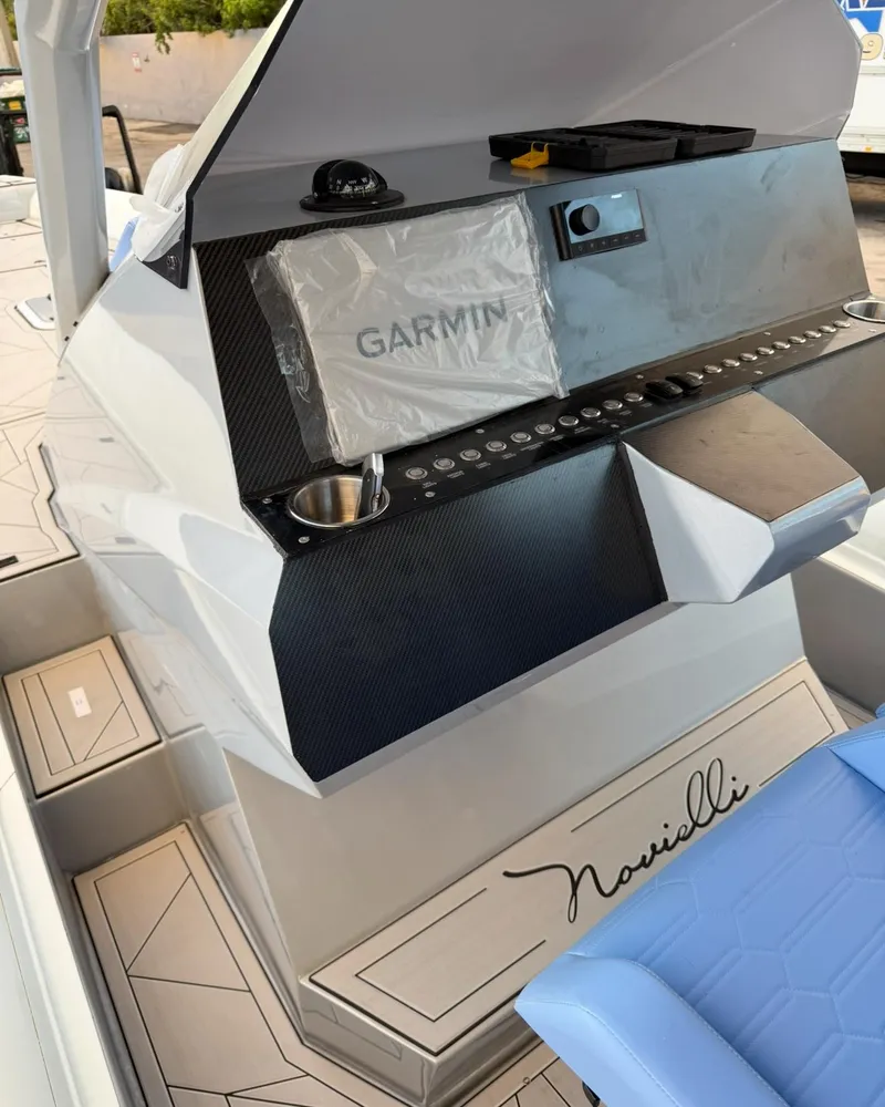 Slide: The Image of Control panel of a 2026 Novielli Veloche 349 boat with Garmin navigation system. - 9