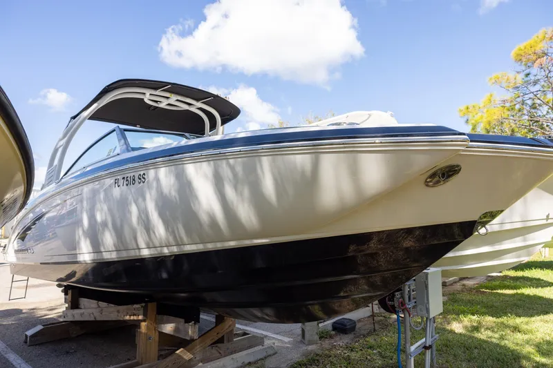 The Image of 2018 Chaparral 264 Sunesta boat on display under a clear blue sky. - 0